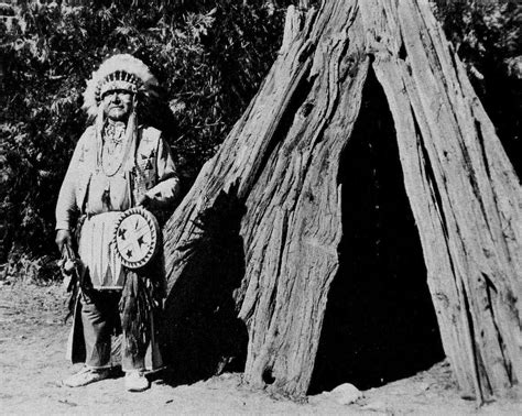 The Southern Sierra Miwok Chris Brown (Chief Leeme) beside cedar bark house in Yosemite National ...