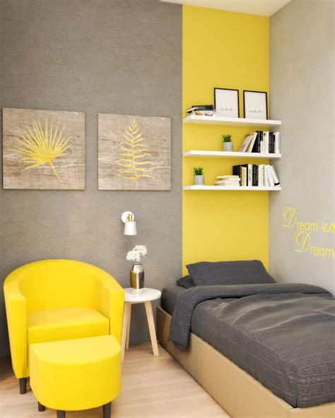 a yellow and gray bedroom with two chairs