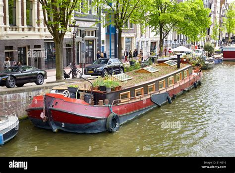 Houseboat barge, Amsterdam canal - Holland Netherlands Stock Photo ...