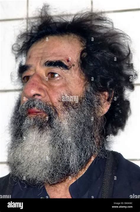 Former President of Iraq Saddam Hussein shortly after his capture by ...