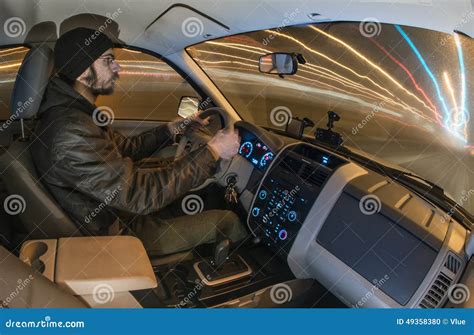 Man Driving Car At Night Stock Photo - Image: 49358380