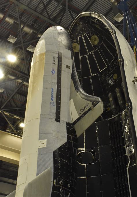 The US Military's X-37B spaceplane loaded onto a Falcon Heavy to be ...