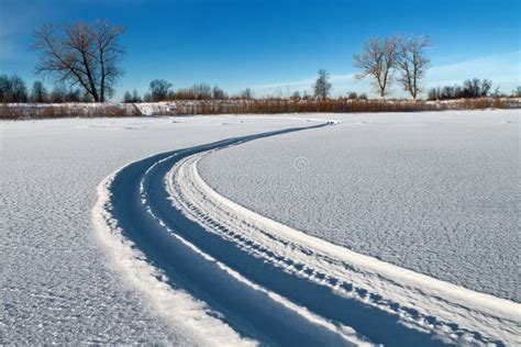 The snowmobile tracks stock photo. Image of trees, curve - 65650808