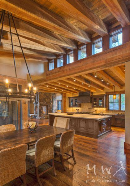 Exposed heavy timber beams with wood ceiling at high and low shed roof forms. Clerestory windows ...