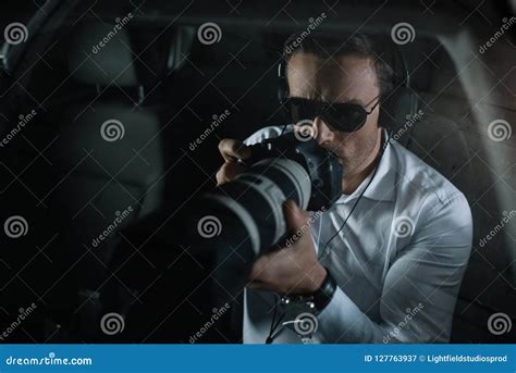 Male Private Detective in Headphones Doing Surveillance by Camera with Object Glass Stock Image ...