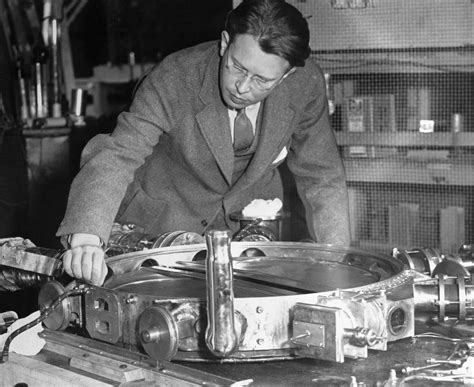 Ernest Orlando Lawrence examining 37-inch cyclotron vacuum chamber with ...