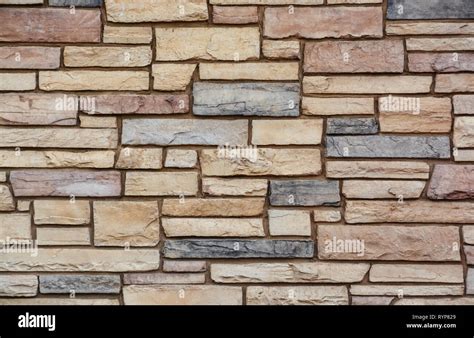 Brown colored stone setting. Cut stone wall texture Stock Photo - Alamy