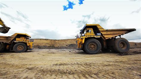 Mining Dump Trucks In The Open Pit Mine Stock Footage Video 1301347 - Shutterstock