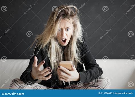 Angry Woman Looking at Phone Stock Photo - Image of chat, feel: 115286096