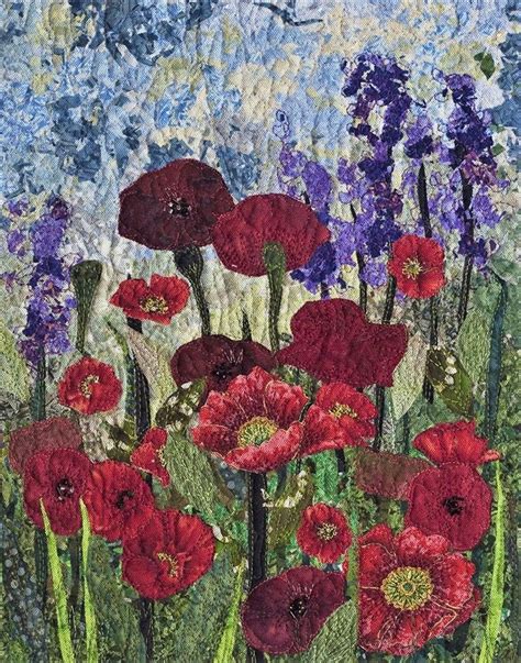 This art quilt features poppies growing in a meadow. It's the work of ...