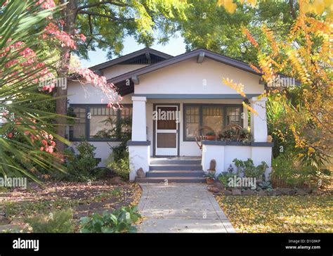 Front exterior white bungalow with blue trim; Chico; California; USA ...