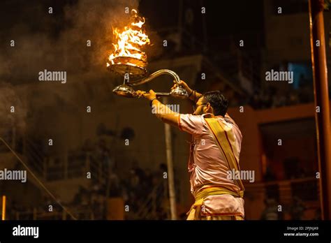 Ganga aarti, Portrait of an young priest performing river ganges ...