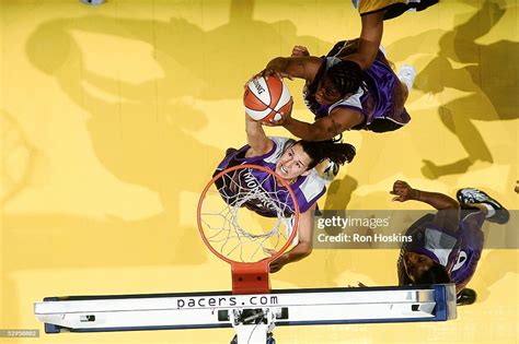 Ticha Penicheiro of the Sacramento Monarchs goes for a rebound... News ...