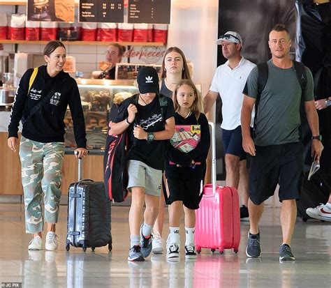 Bec Hewitt and husband Lleyton look cheerful as they head home for Christmas - ReadSector