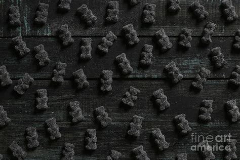 Black Gummy Bears On Wood by Westend61