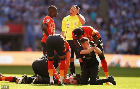 Lockyer celebrates Luton's Premier League promotion in his hospital bed - after collapsing in ...