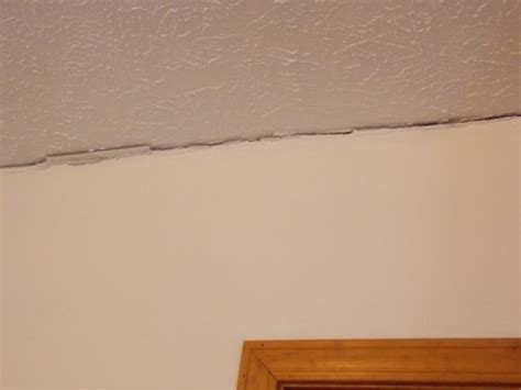 Cracks where wall meets ceiling