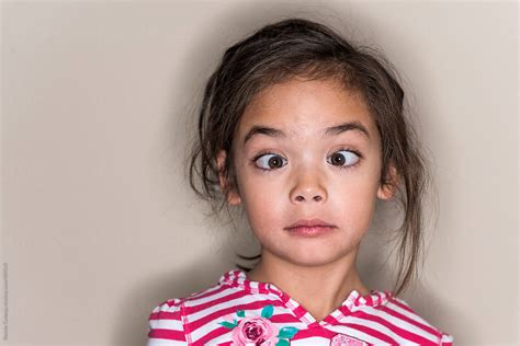 Cute Young Girl Making A Funny Face In A Field By Stocksy Contributor Jakob Lagerstedt ...