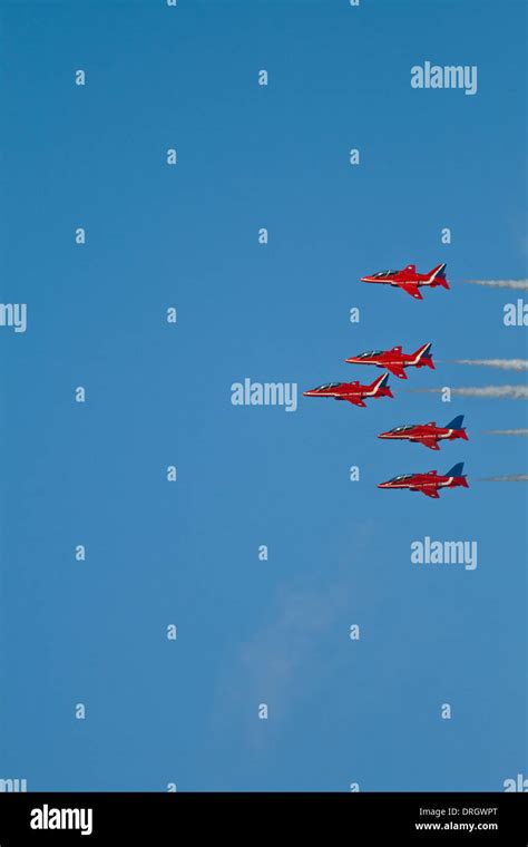 Five Red Arrows in Formation Stock Photo - Alamy