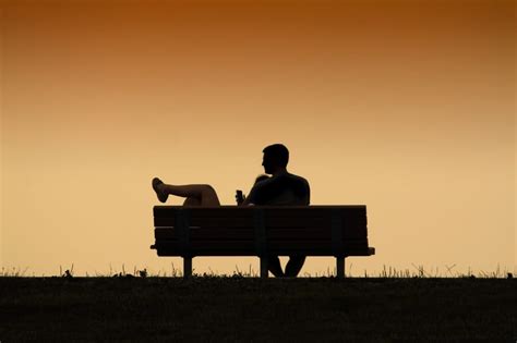 silhouette of man sitting on bench free image | Peakpx