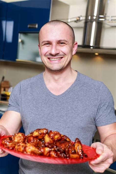 Man Presenting a Platter of Chicken Wings Stock Image - Image of ginger ...