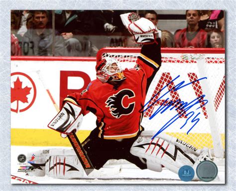 Miikka Kiprusoff Calgary Flames Autographed Glove Save 8x10 Photo - NHL Auctions