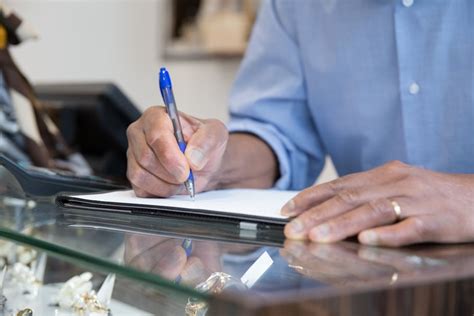 Close-up of Man Writing on Paper · Free Stock Photo