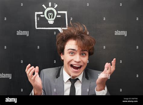 Funny man with chalked graphs painted on chalkboard Stock Photo - Alamy