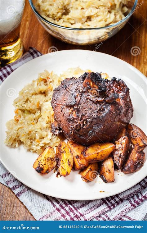 Pork Knuckle with Fried Sauerkraut and Baked Potatoes Stock Photo - Image of cooking, nutrition ...