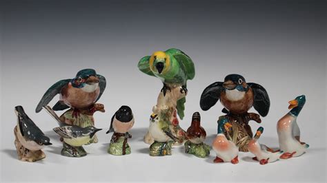 Eleven Beswick models of birds, including two Kingfisher, No. 2371, Parakeet, No. 930, and three duc