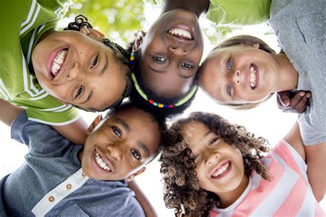 Children Smiling in a Huddle - Global Ecovillage Network