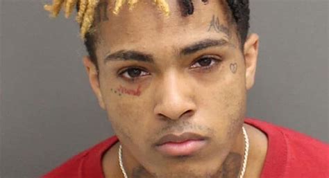 Photo: Mugshot of XXXtentacion (that's a red tattoo under his right eye ...