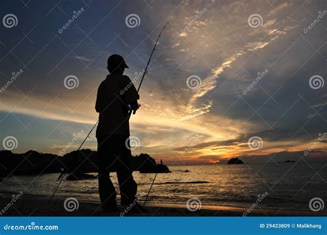 Sunset with a Fishing man. stock image. Image of ocean - 29423809