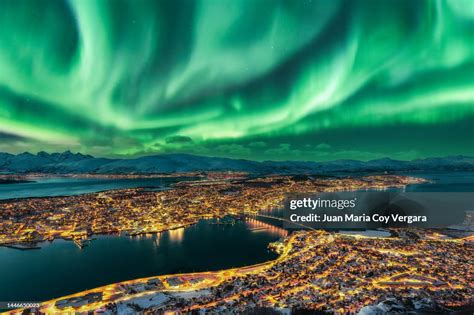 Aurora Borealis Dancing Over Tromso Urban Skyline Northern Norway High-Res Stock Photo - Getty ...