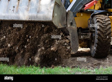 Excavator while working Stock Photo - Alamy