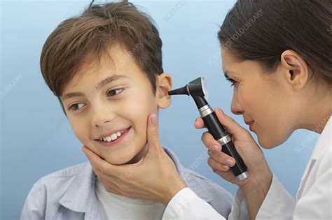 Ear examination - Stock Image - F034/8519 - Science Photo Library