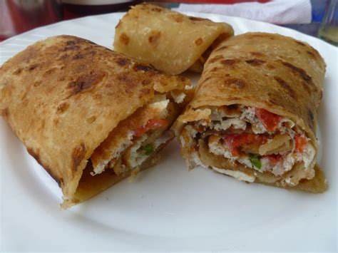 Ugandan street food- called a Rolex It's a omelette wrapped in chapatti ...