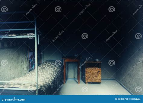 Empty Prison Cell with Iron Bunk Bed and Bedside Table Stock Photo ...