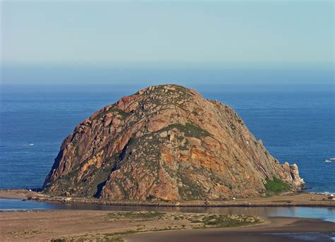 Morro Rock, the ancient landmark towering 576 feet above the entrance to Morro Bay, was named ...