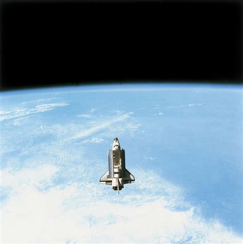 Aerial View Of The Space Shuttle In Orbit Above Earth Photograph by ...