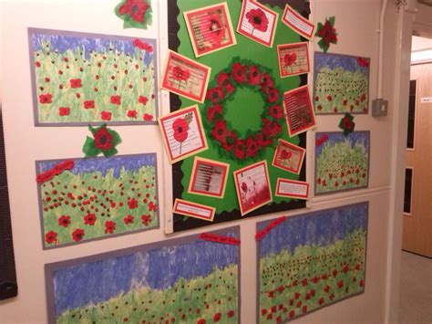 Rememberance day wall art display - poppy paintings done using fingers and literacy poems ...