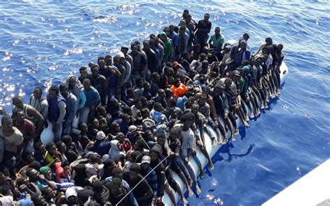 Up to 100 migrants, including babies, feared dead after boat sinks off the coast of Libya