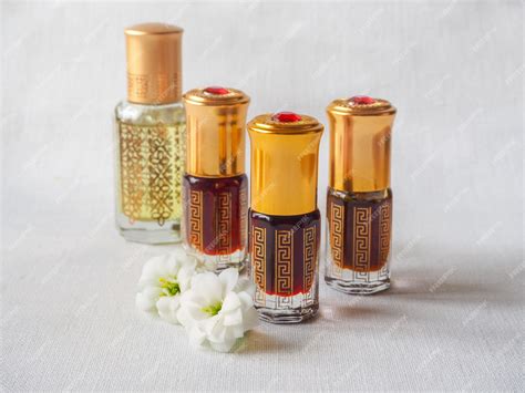 Premium Photo | Arabian oud attar perfume in mini bottles.