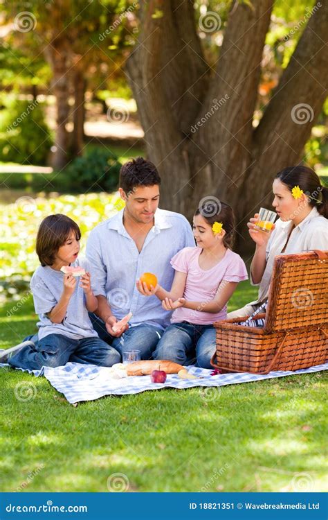 Lovely Family With Kids Having Fun While Cooking Together In Kitchen At ...