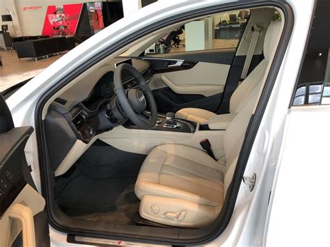 Ibis White with Tan interior on the 2018 Audi A4, front row seat and ...