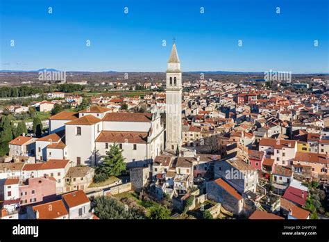 an aerial view of Vodnjan, the parish church of St. Blasius with ...