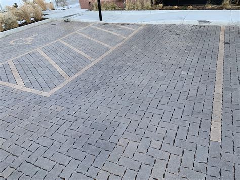 The stripes in this parking lot are made with different colored pavers ...