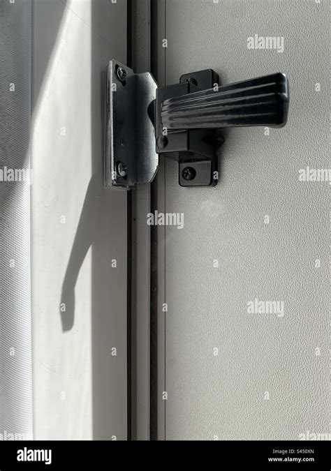 Screen door handle, lock Stock Photo - Alamy