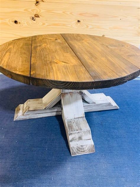 Bring this rustic farmhouse round coffee table into your living room today. This handmade wooden ...
