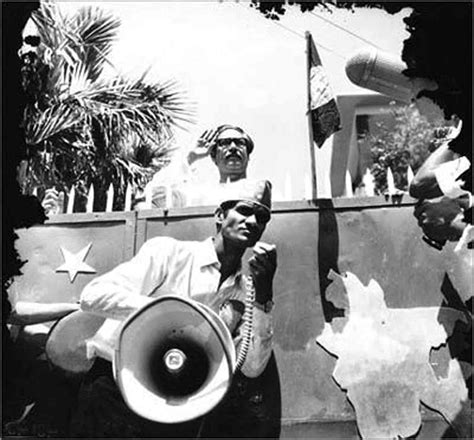 MARCH 23, 1971: THE AWAMI LEAGUE FLAG BEING RAISED AT THE RESIDENCE OF SHEIKH MUJIBUR RAHMAN ...